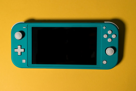 LONDON - MARCH 12, 2020: Nintendo Switch Lite Handheld Video Game Console