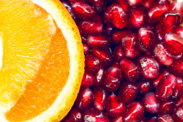 Background with pomegranate berries. The orange on the pomegranate berries.
