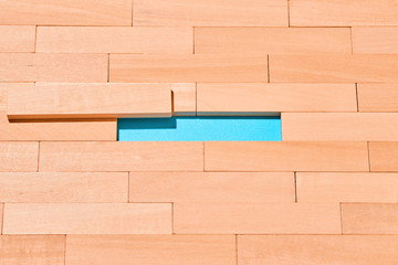 The wooden planks are staggered on a light blue in the center of an empty space for Your text....