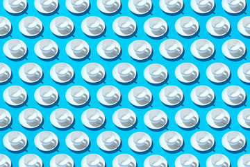 Empty coffee mugs on a saucer on a light blue background. Abstract background.