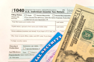 Individual Income Tax Return Form 1040 and social security card of USA. Submission time. 