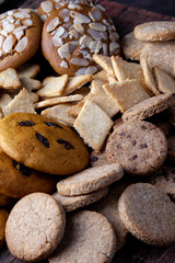 A set of different homemade cookies. Cookies close-up. Background from delicious pastries. Cookie with coconut, mishdal, chocolates, raisins, lingonberries. Round, rhombuses, bears, flowers shapes.