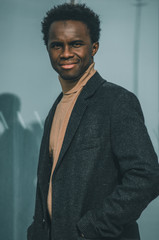 portrait of a young black man looking to the camera