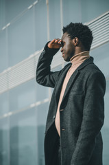 businessman looking towards the horizon with his hands
