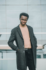 portrait of man standing in front of a building