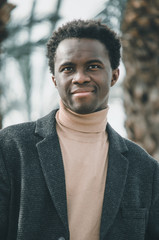 Black businessman smiling and looking to the camera