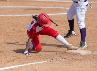 Girl Fastpitch Softball player in action during a competitive game
