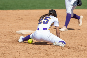 Girl Fastpitch Softball player in action during a competitive game