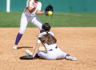 Girl Fastpitch Softball player in action during a competitive game