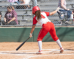 Girl Fastpitch Softball player in action during a competitive game