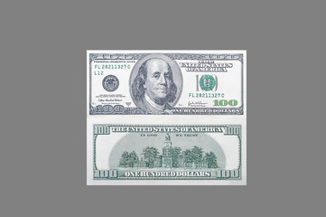 Front and back side of one hundred US dollar banknote with portrait of american president benjamin franklin on isolated gray background