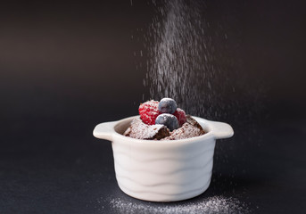 Chocolate suffle with blackberries and raspberries on the top