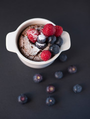 Chocolate suffle with blackberries and raspberries on the top