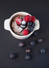 Chocolate suffle with blackberries and raspberries on the top