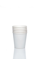 A stack of small cardboard glasses. Cardboard cups for espresso coffee.