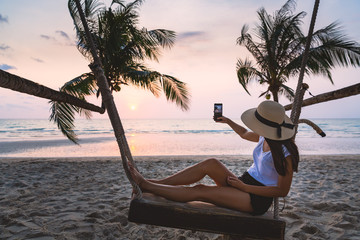 Woman on swing in beach
