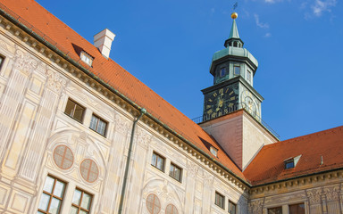 Fototapeta na wymiar Clock tower in Munich in front of blue sky