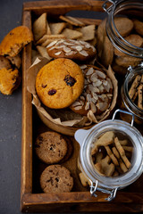 A set of different homemade cookies. Cookies close-up. Background from delicious pastries. Cookie with coconut, mishdal, chocolates, raisins, lingonberries. Round, rhombuses, bears, flowers shapes.