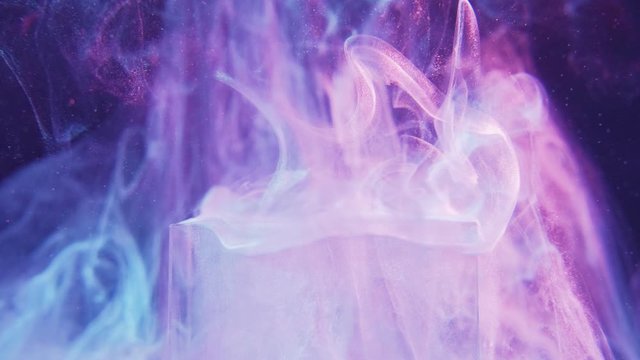 Glitter steam flow. Esoteric illusion. White fume motion over cube in grape compote purple light.