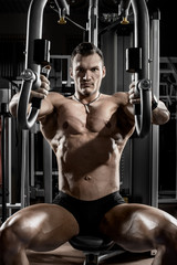 Fototapeta na wymiar guy bodybuilder with apparatus
