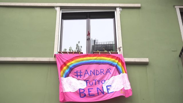 Europe, Italy, Milan March 2020, Coronavirus emergency - On the windows of the city hang sheets designed by children with rainbow and the words "everything will be fine" ( Tutto Andra' bene )