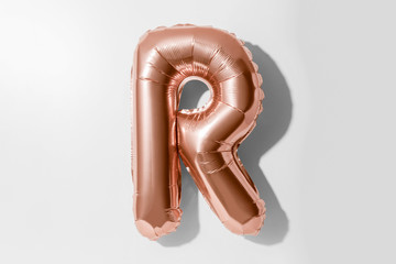 Letter R, Rose gold foil balloon alphabet isolated on white background with Clipping Path