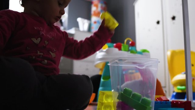 2 year old female child at home playing with toys