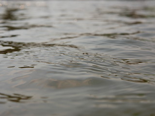 Close up and selective focus of flowing river surface