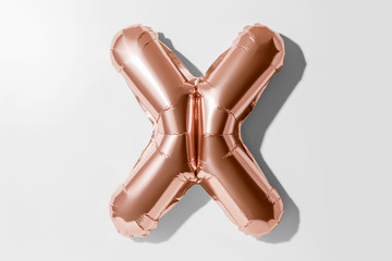 Letter X, Rose gold foil balloon alphabet isolated on white background with Clipping Path