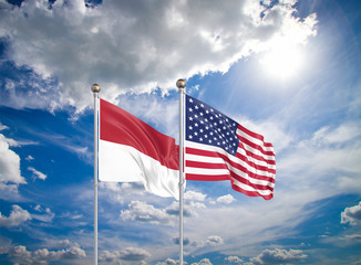 United States of America vs Indonesia. Thick colored silky flags of America and Indonesia. 3D illustration on sky background. - Illustration