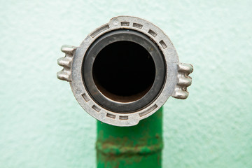 Fire hydrant nozzle green, close-up hose connection