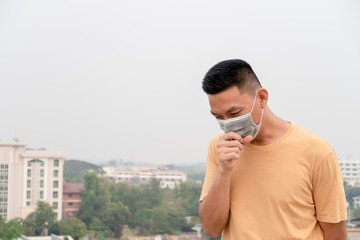 Asian Man wearing facial hygienic mask . Virus protection , Air pollution, concept