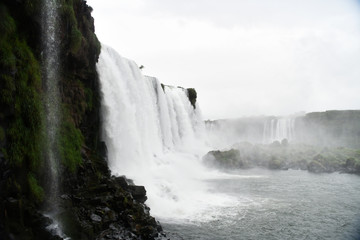 rushing waterfall and mountain river in the jungle