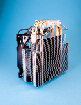 Computer cooler isolated on background. A large new cooling cooler for a personal computer. Component in the system unit. A cooling system of computer. Bright mesh CPU cooler with glare effect. 