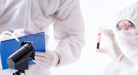 Two chemists working in the lab