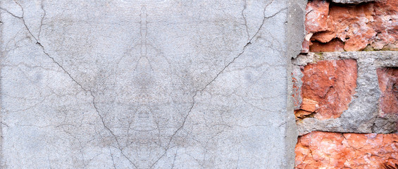 old red brick wall and gray cracked stucco