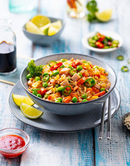 Asian fried rice, Cantonese cuisine. Blue wooden background.