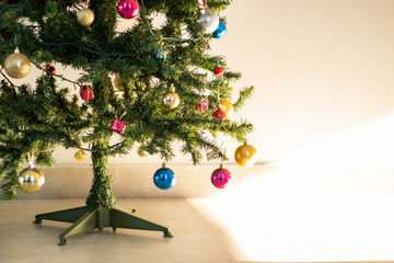 christmas decoration on the tree foot. colored balls