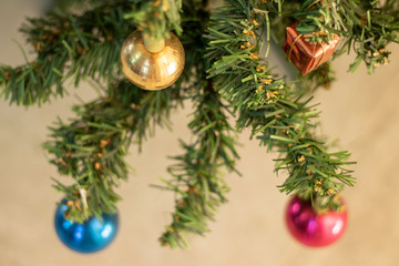 Naklejka na ściany i meble christmas decoration on the tree. colored balls