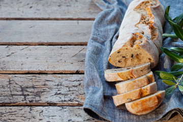 Bread ciabatta sliced. Wooden background. Copy space. Top view.