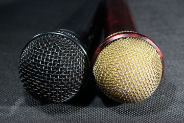 Obraz premium Microphones with wire mesh network photographed in the studio with flash light