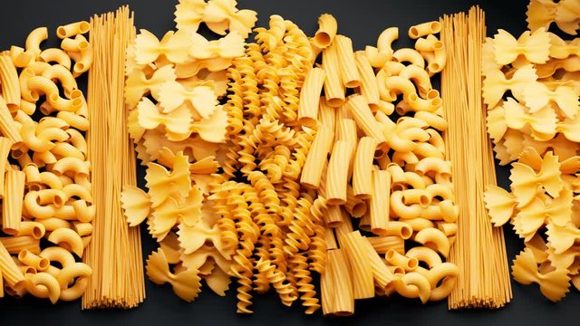 Pile of arranged raw different kinds of pasta. Seamlessly looping animation.