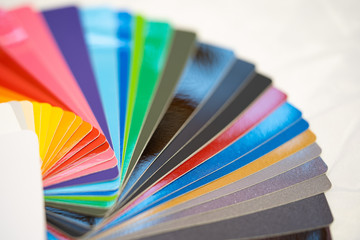 Close-up of color palette guide of stickers for decoration on white background.