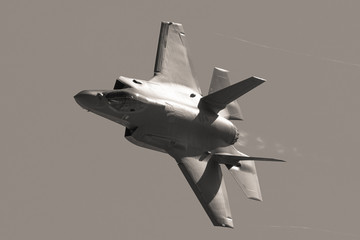 Extremely close view of a F-35 Lightning II  approaching  with afterburner on 