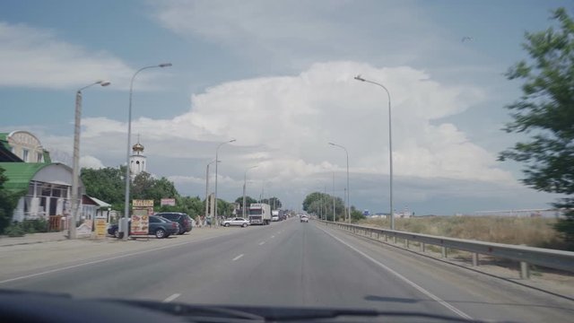 Summer road near the black sea in Crimea. View from the car.