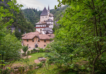 Fototapeta na wymiar Sanctuary of San Romedio dedicated to Saint Romedius situated on a steep rocky spur in the natural scenery of the Val di Non, Trentino, Italy  