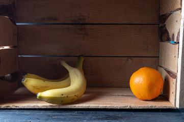 Fruits and citruses in a box. Wooden crate and fruits.