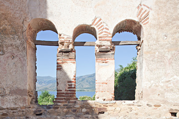 Old arches of a church in St. Achilles Island in Greece