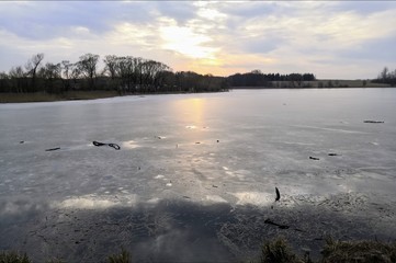 sunset on the lake in winter
