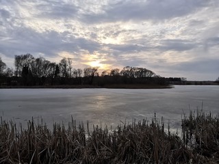 sunset over lake in winter